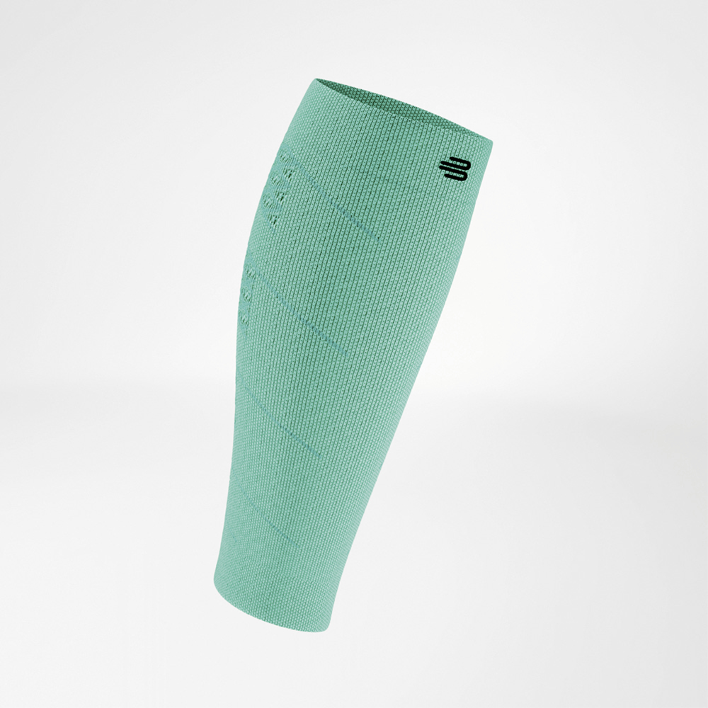 Front view of a green calf compression sleeve. The lightweight, breathable fabric has a uniform knit with a logo placed at the top edge.