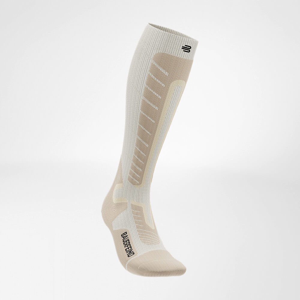 Ski sock downhill with merino wool beige side front view Side front view of the beige sports sock for alpine skiing with merino wool