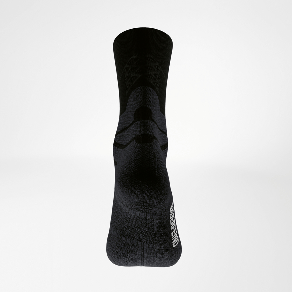 Rear view of a black Run Performance Midcut sock: clearly defined Achilles tendon comfort zone, reinforced heel and sole, and BAUERFEIND lettering on the side.