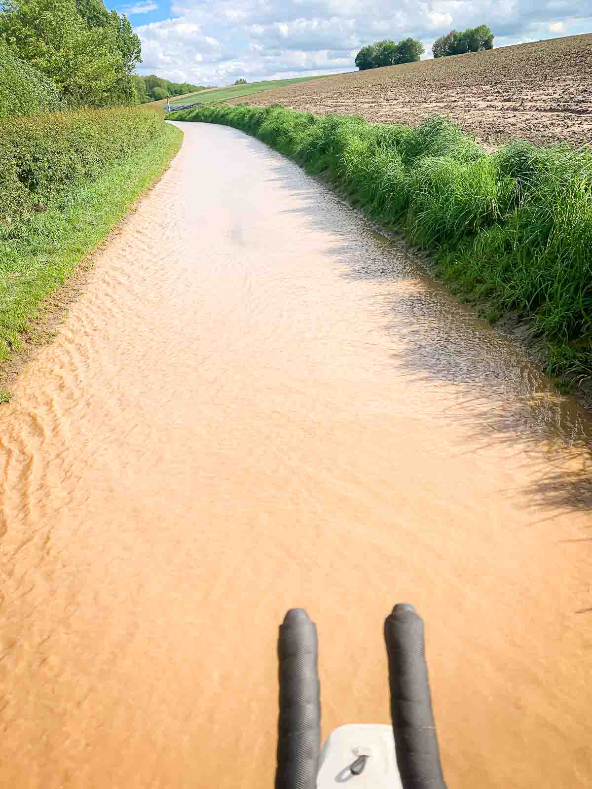 One road is completely flooded with water.
