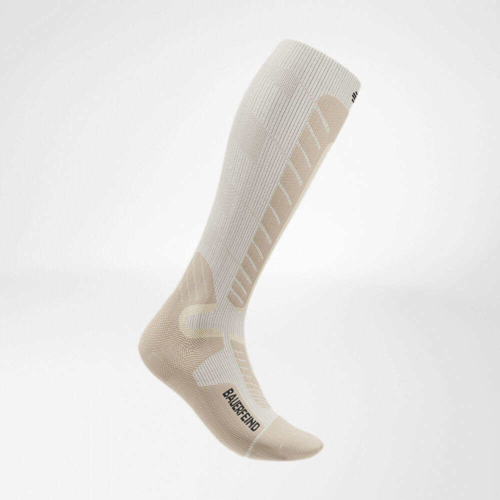 Ski sock downhill with merino wool beige side view Side view of the beige sports socks for alpine skiing with merino wool