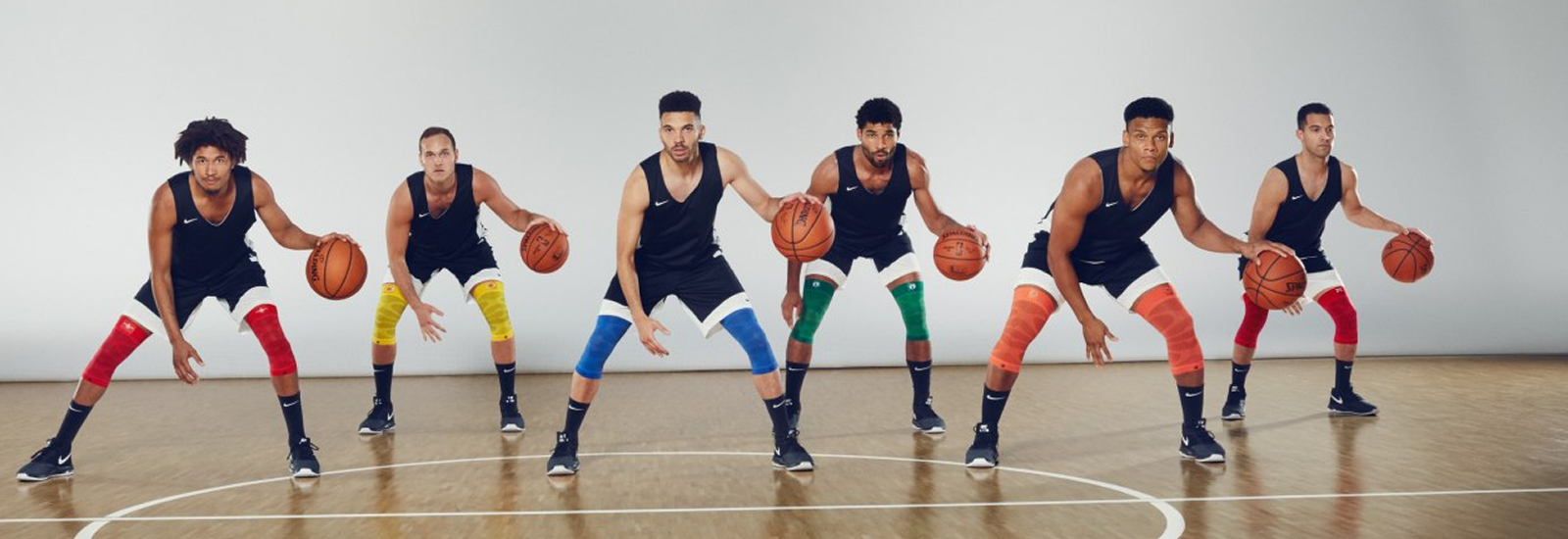 Dirk Nowitzki coaches six basketball players with colorful knee bands