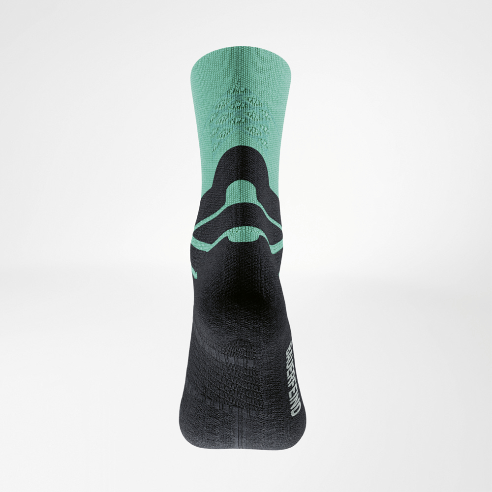 Rear view of the green Run Performance Mid Cut Sock with black foot area and distinctive knit structure for targeted midfoot support.