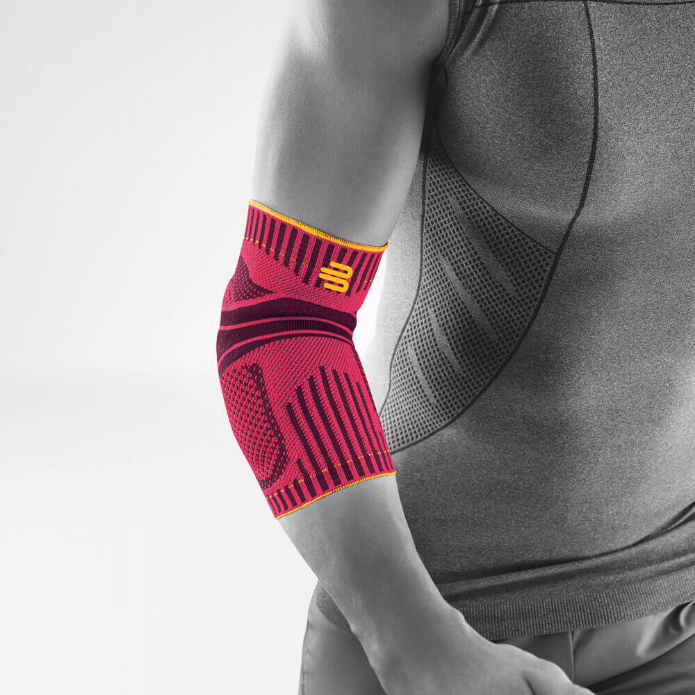 Ellenbow bandage pink front view diagonally Complete view of the pink sports bandage for the elbow on the stylized gray body