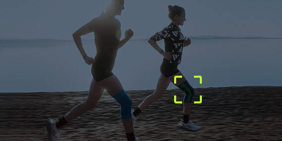Two runners with knee tandages in front of blue filters with a pain area on the knee at one of the runners