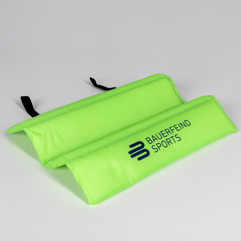 Studio shot of Bauerfeind Sports seat cushion in bright green, ideal for on-the-go.