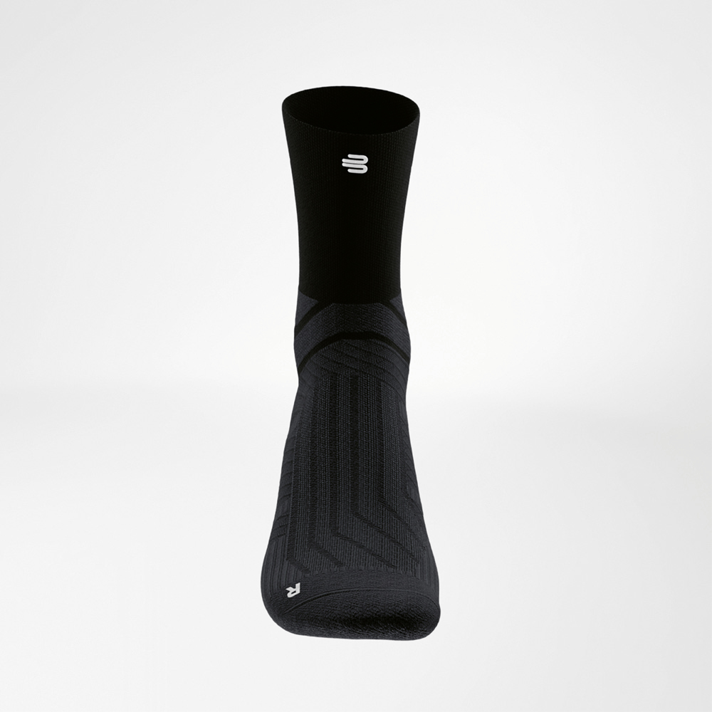 Front view of a black Run Performance Midcut Sock with bold knitted structures that create a dynamic, minimalist style.