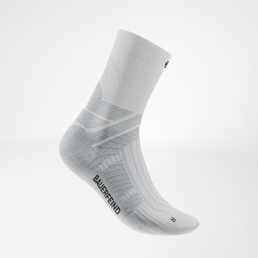 Detailed side view of a white Bauerfeind Run Performance Midcut Sock with visible zone structures and black logo print.