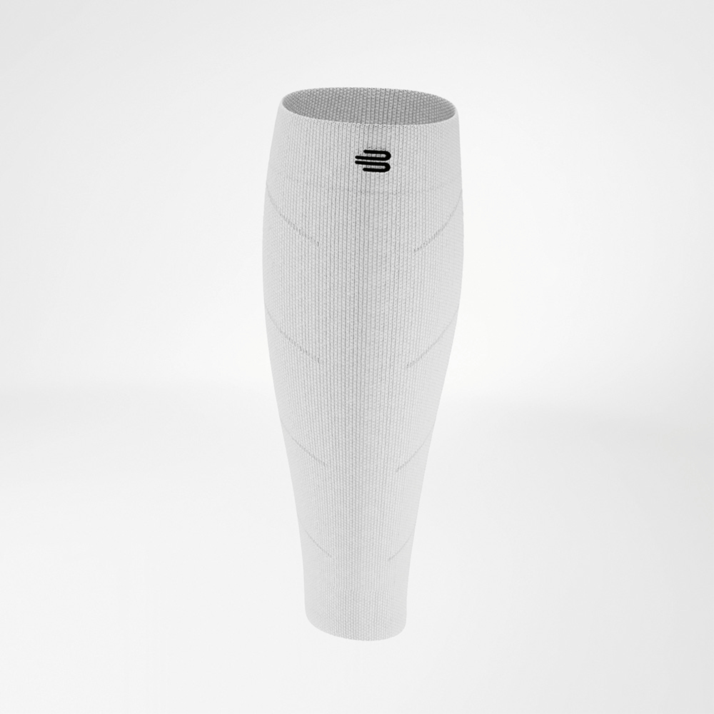 White calf compression sleeve in side view, showing the finely knitted texture and snug fit, providing stability and energy while running.