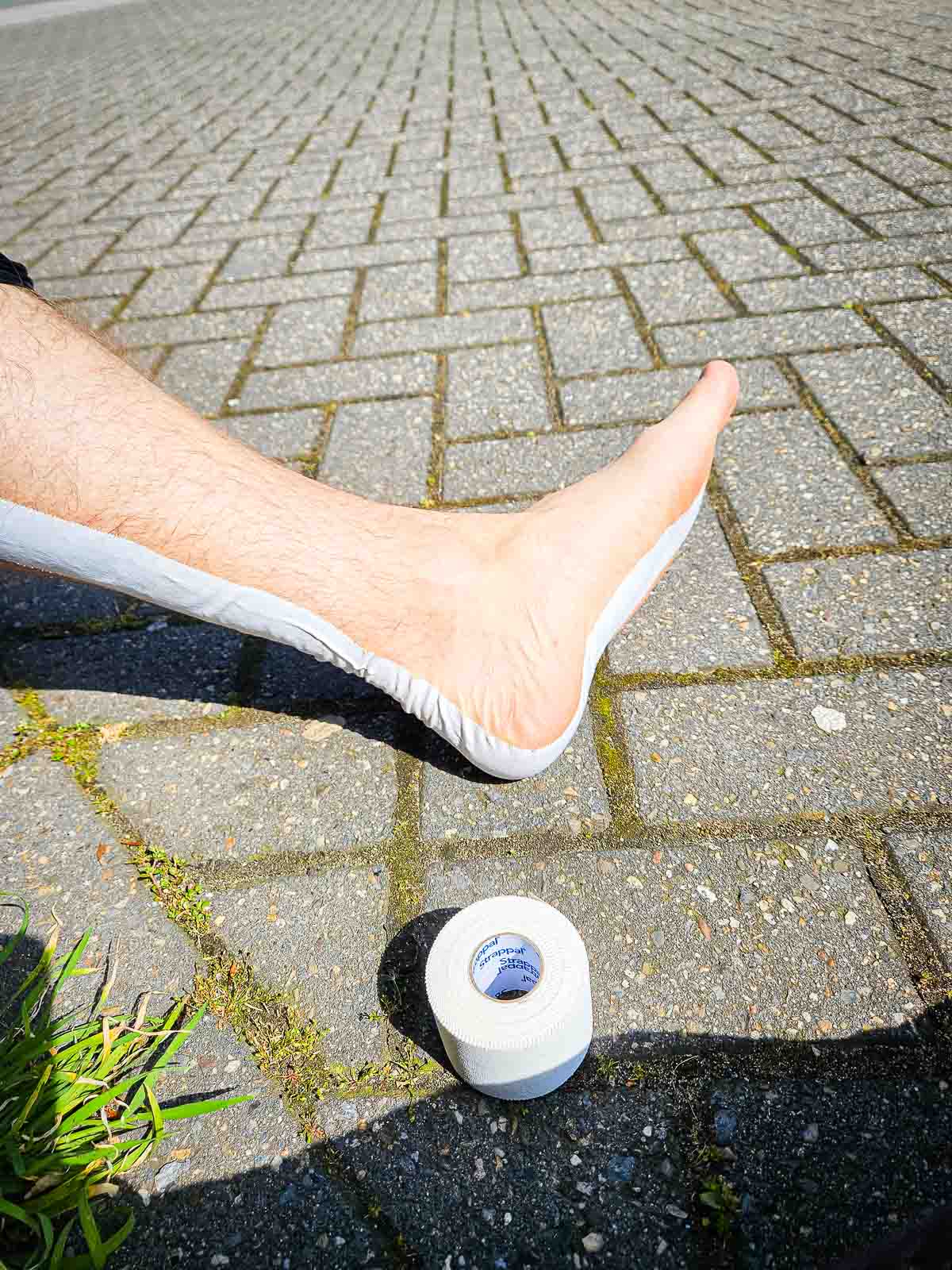 One ankle was taped with a roll of tape