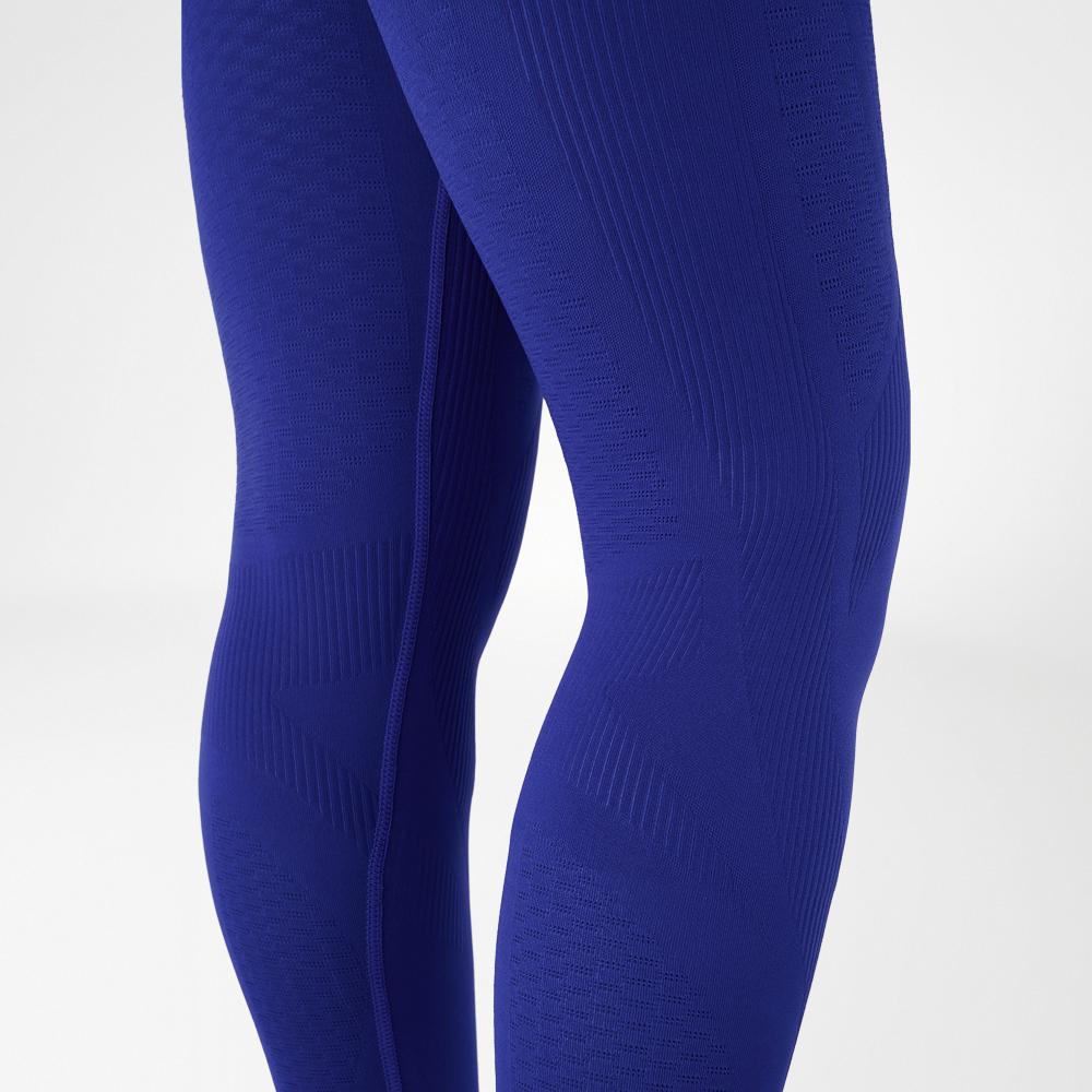 Knees of a woman wearing navy blue compression tights