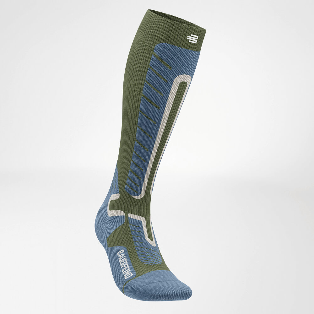 Side view of a green ski compression sock with reinforced knit pattern for enhanced stability and comfort. Perfect for winter sports and long days on the slopes.