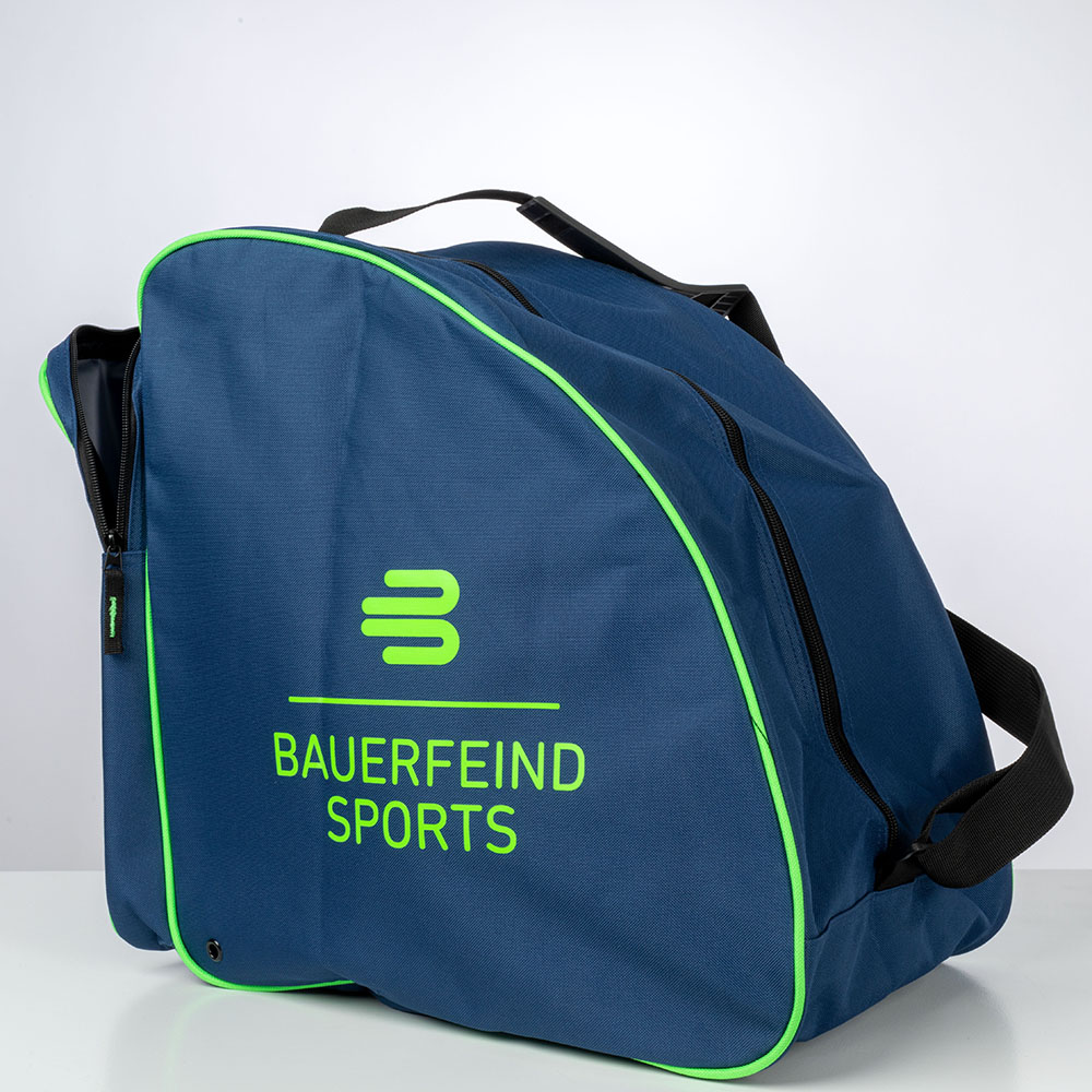 A blue Bauerfeind Sports ski boot bag in a studio shot on a white background. The bag features a black zipper and a green trim along the edges. The "Bauerfeind Sports" logo is prominently displayed on the front.