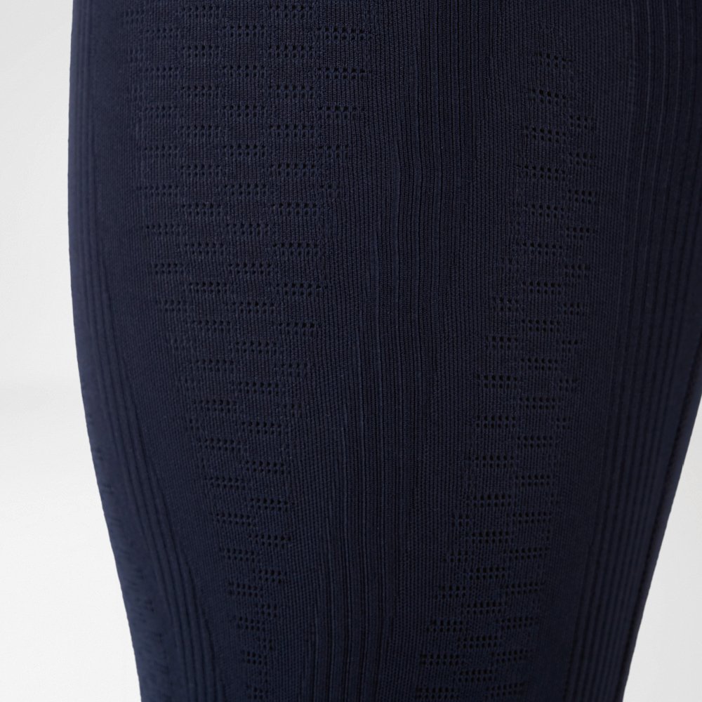 Close-up of compression trousers with 3D power dots and targeted compression technology.