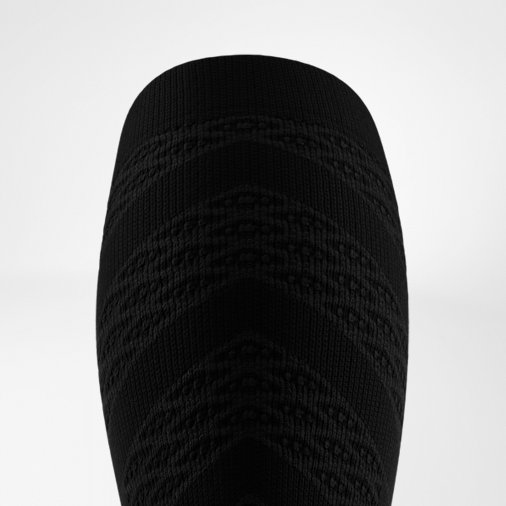 Top view of a black compression sleeve featuring a zigzag knit pattern for stability and a powerful athletic look.