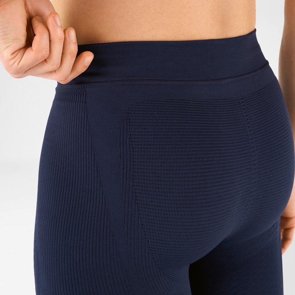 Torso section with tight-fitting, dark blue men's sports trousers