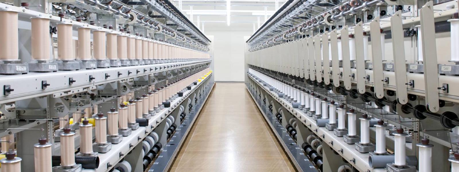 Umwinderei Bauerfeind Gang with circulating machines on the left and right of Bauerfeind