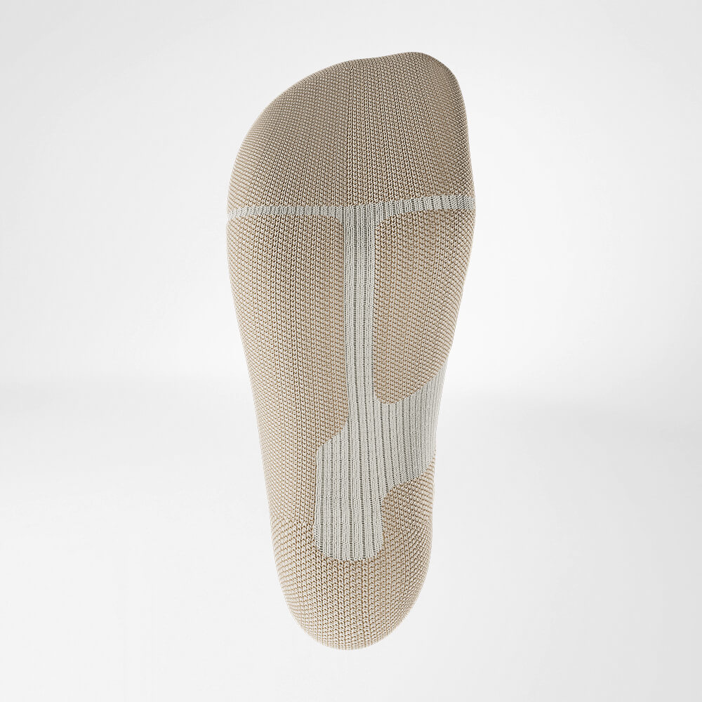 Ski sock downhill with merino wool beige detail relief sole Detail view on relief sole of the beige sports sock for alpine skiing with merino wool