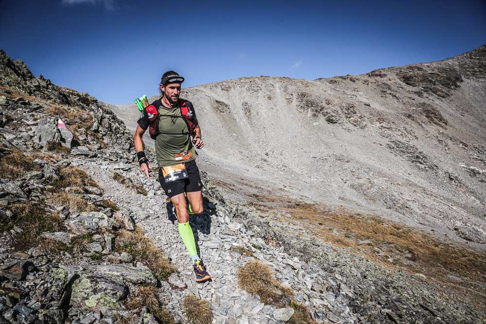 Lord Jens Kramer ultra running on a rocky trail in alpine terrain