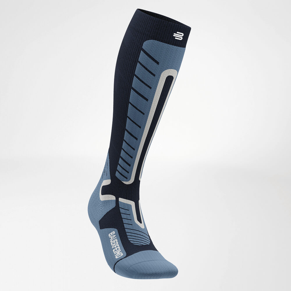 Side view of a blue ski compression sock with reinforced zones for enhanced stability and comfort. Designed for maximum performance in skiing.