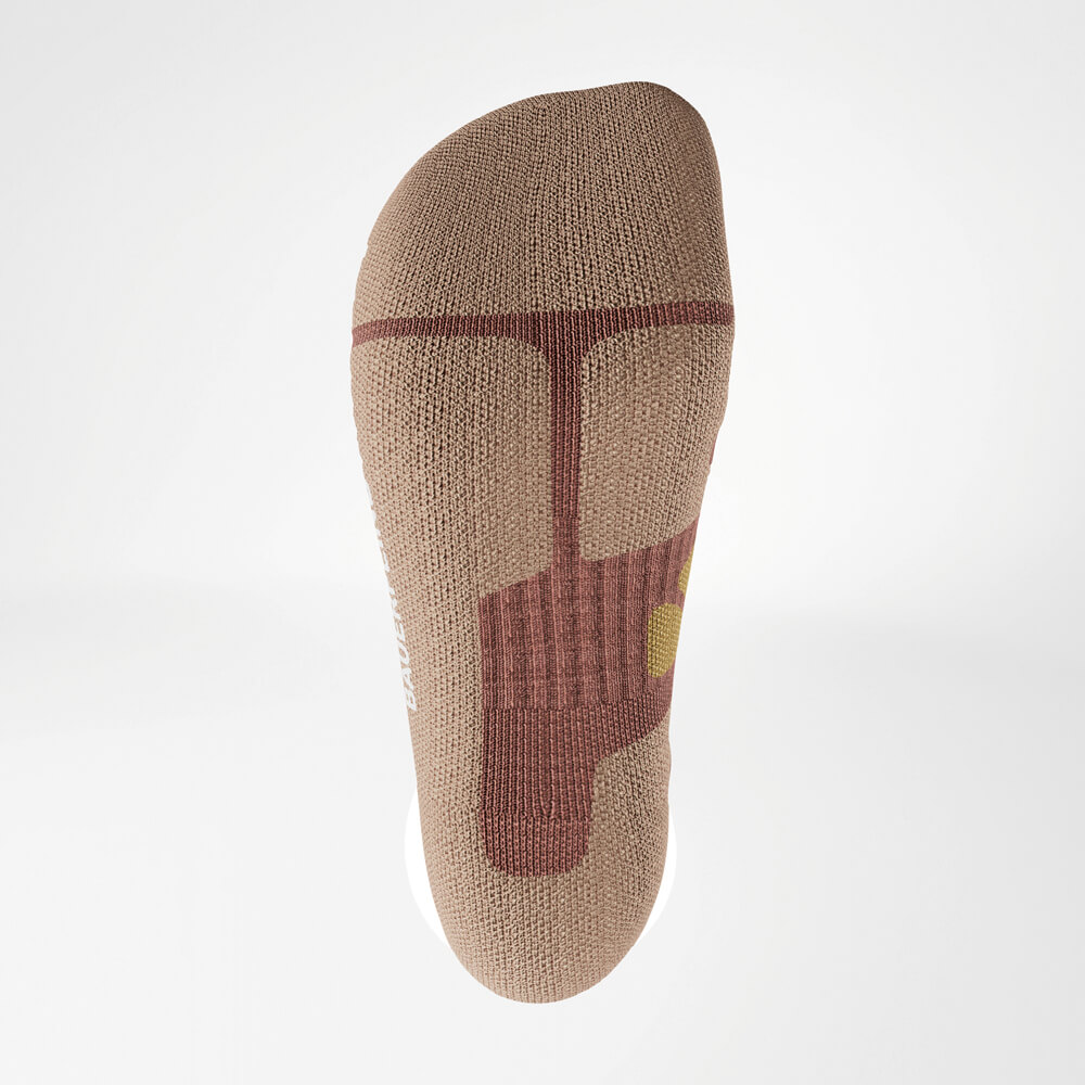 Underside of an outdoor sock in coral and gray, showcasing special cushioning and durability in the sole area.