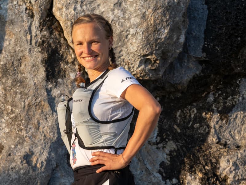 Hahner Post in front of a rock wall