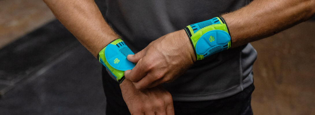 Detailed view of a man who wears a sports Wrist Strap on both wrists