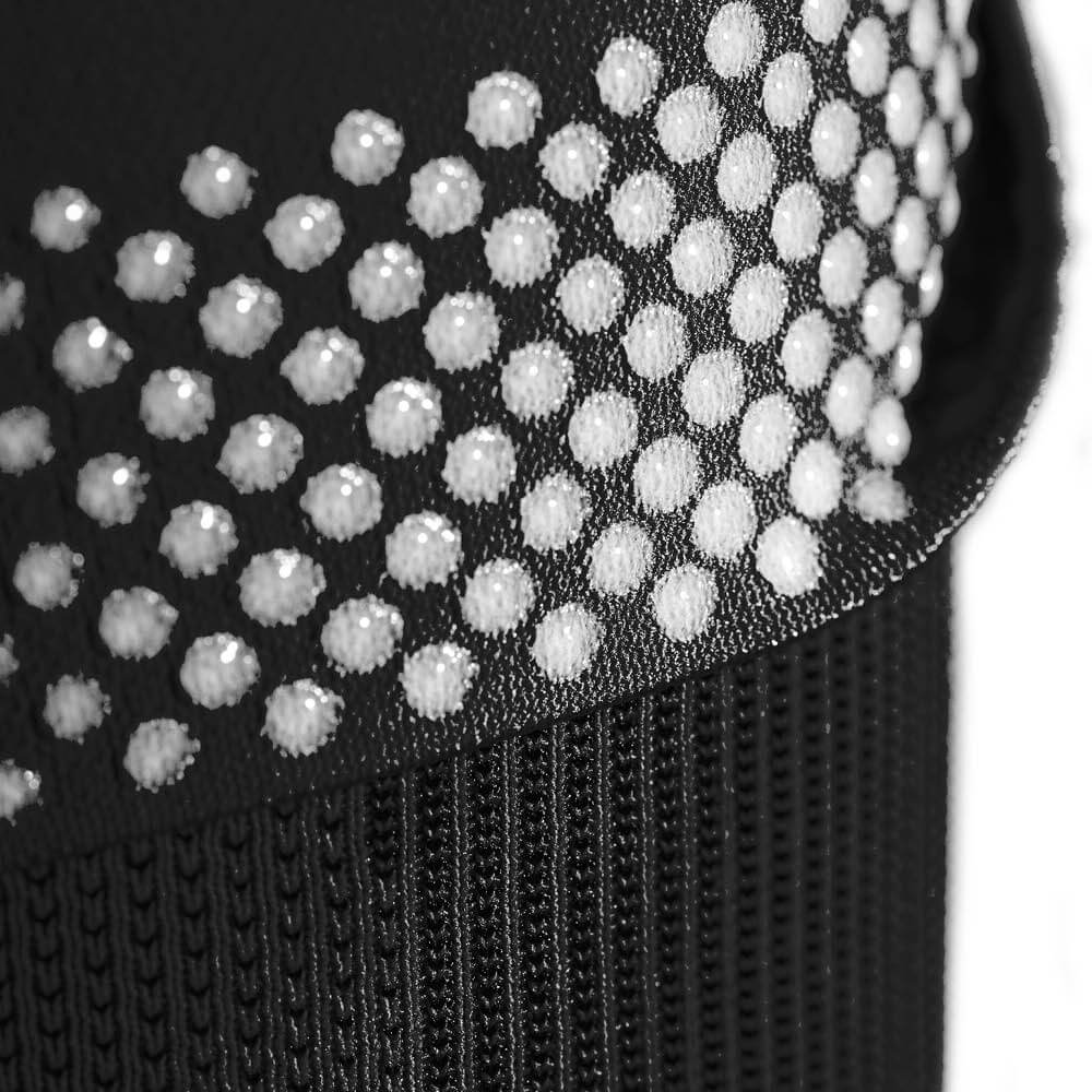 Detailed view of a black NBA KNEE SLEEVES with the upper part and view of the silicone healing nops