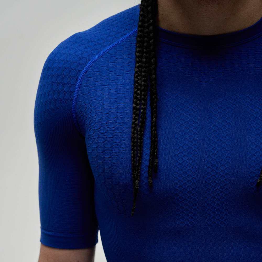 Shoulder of an athlete in a dark blue sports top