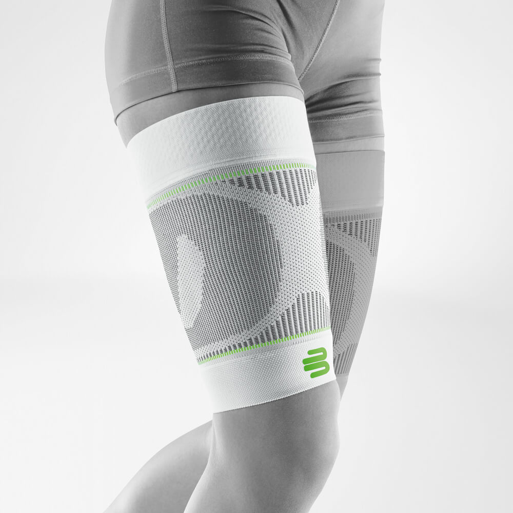 Thigh Sleeves White on the front diagonally Complete view of the white thighs Sport Sleeves on the stylized gray leg