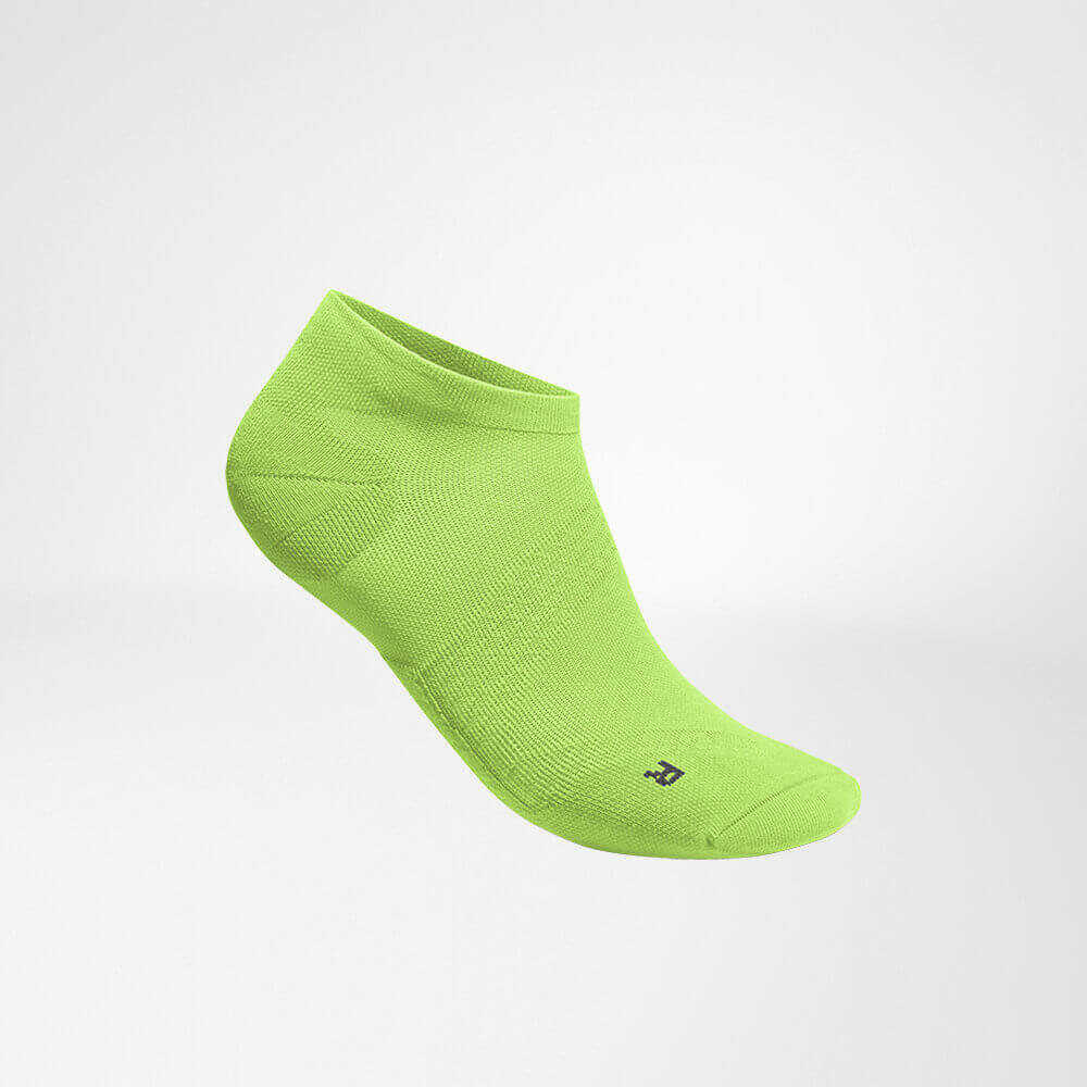 Lateral complete view of the green short, light running sock