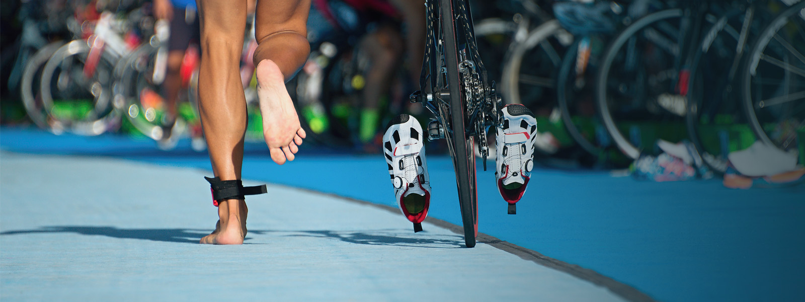 Triathlete is on the way to the transition zone in triathlon