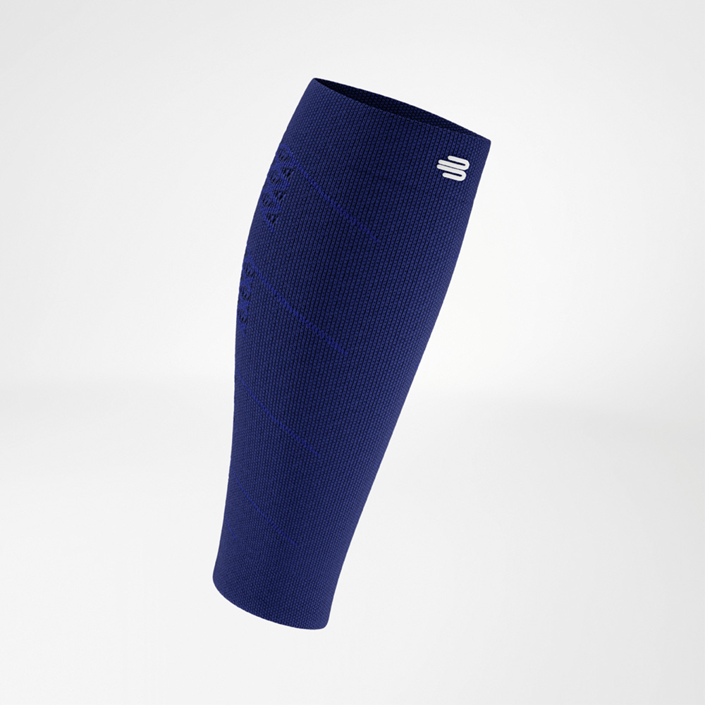 Blue calf compression sleeve in a front view, with distinct knit texture and a white logo at the top band. The design tapers anatomically towards the lower part.