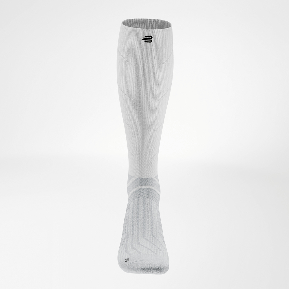 Frontal view of the white Run Performance Socks Long showing symmetrical design and defined compression zones.