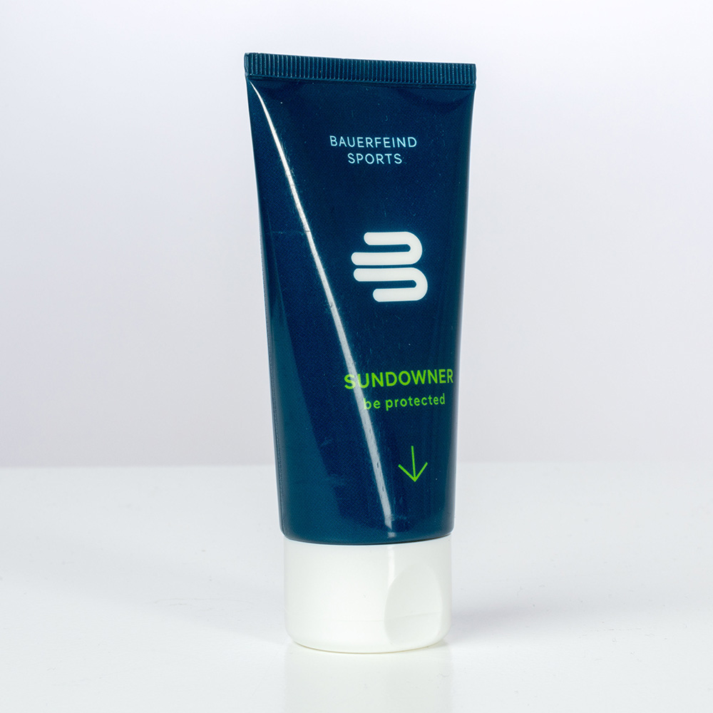 Bauerfeind Sports sunscreen "Sundowner" in a dark blue tube, ideal protection for outdoor activities.