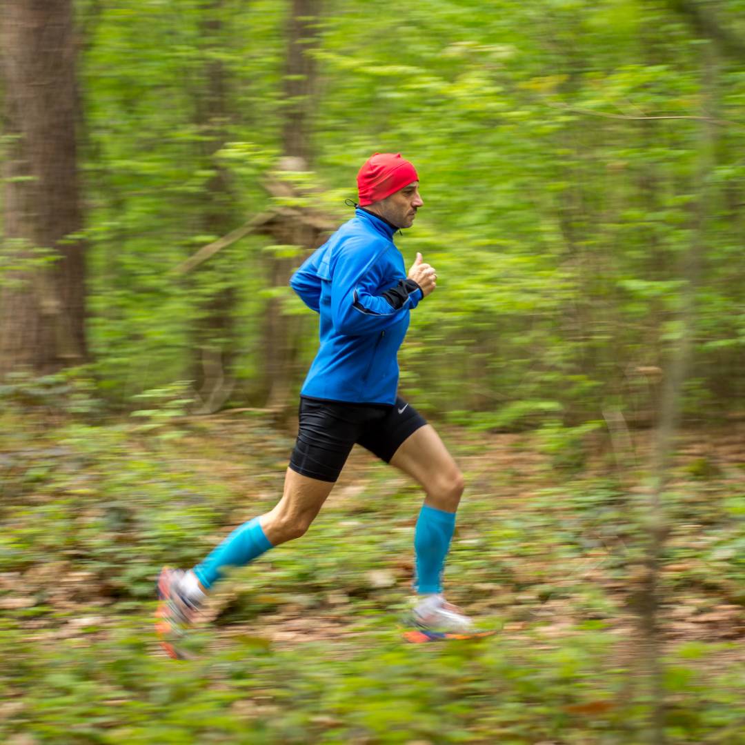Running-Training_guy-with-hat-forest_Compression-Sleeves-Lower-Leg-rivera.jpg