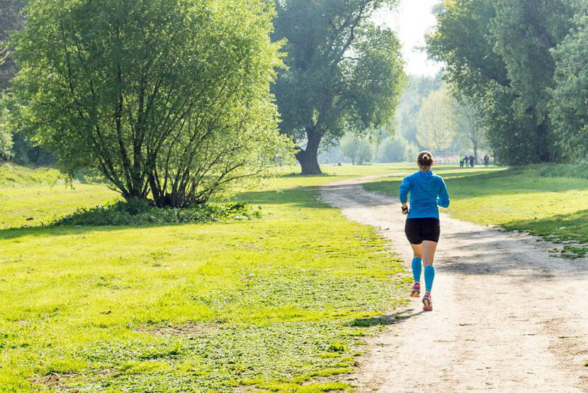 Running through park girl blue sweater Lower Leg Sleeves rivera.jpg